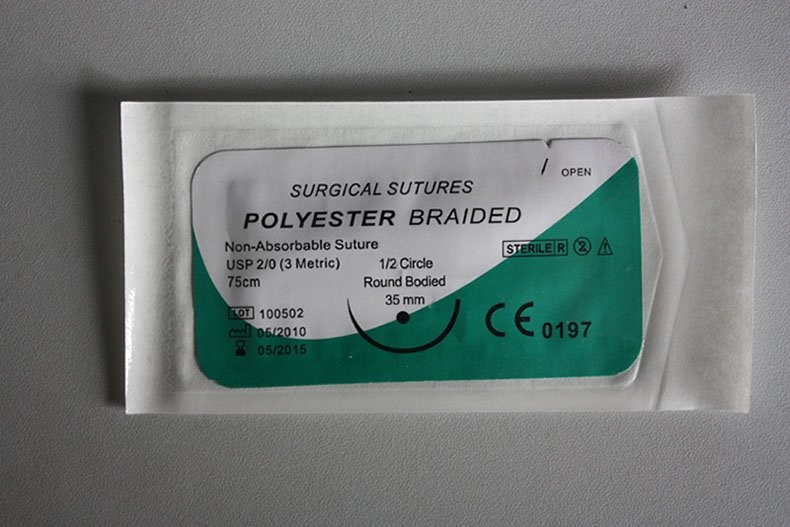Polyester surgical suture material